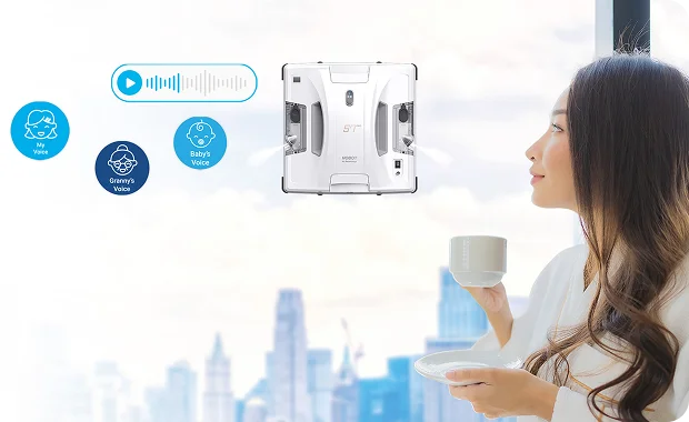 Woman looking out window with city view and HOBOT device indicators